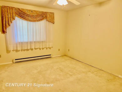 Enjoy easy living in this 2-bedroom, 2-full-bath condo perfectly on Swan Valley Golf Club in Michigan - for sale on GolfHomes.com, golf home, golf lot
