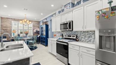 This beautifully appointed DREAMSICLE sits on a unique lot with on LPGA International Golf Course in Florida - for sale on GolfHomes.com, golf home, golf lot