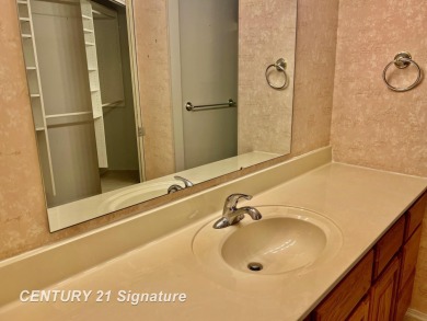 Enjoy easy living in this 2-bedroom, 2-full-bath condo perfectly on Swan Valley Golf Club in Michigan - for sale on GolfHomes.com, golf home, golf lot