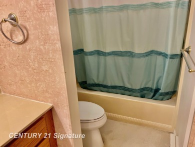 Enjoy easy living in this 2-bedroom, 2-full-bath condo perfectly on Swan Valley Golf Club in Michigan - for sale on GolfHomes.com, golf home, golf lot