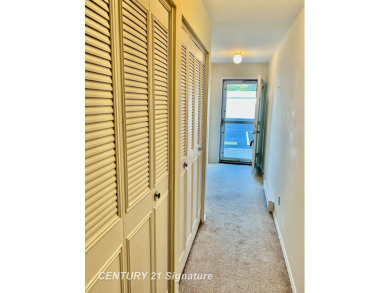 Enjoy easy living in this 2-bedroom, 2-full-bath condo perfectly on Swan Valley Golf Club in Michigan - for sale on GolfHomes.com, golf home, golf lot