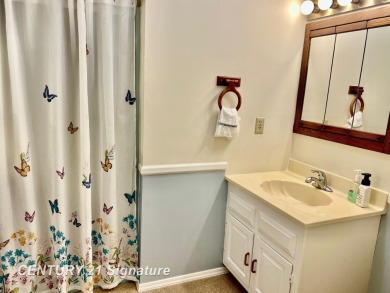 Enjoy easy living in this 2-bedroom, 2-full-bath condo perfectly on Swan Valley Golf Club in Michigan - for sale on GolfHomes.com, golf home, golf lot