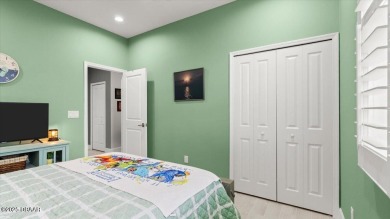 This beautifully appointed DREAMSICLE sits on a unique lot with on LPGA International Golf Course in Florida - for sale on GolfHomes.com, golf home, golf lot