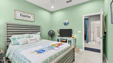 This beautifully appointed DREAMSICLE sits on a unique lot with on LPGA International Golf Course in Florida - for sale on GolfHomes.com, golf home, golf lot
