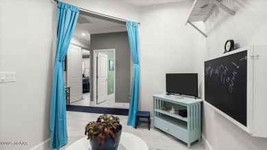 This beautifully appointed DREAMSICLE sits on a unique lot with on LPGA International Golf Course in Florida - for sale on GolfHomes.com, golf home, golf lot