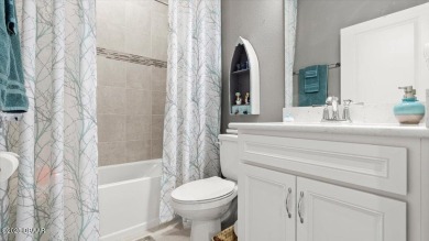 This beautifully appointed DREAMSICLE sits on a unique lot with on LPGA International Golf Course in Florida - for sale on GolfHomes.com, golf home, golf lot