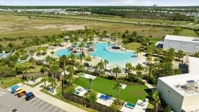 This beautifully appointed DREAMSICLE sits on a unique lot with on LPGA International Golf Course in Florida - for sale on GolfHomes.com, golf home, golf lot
