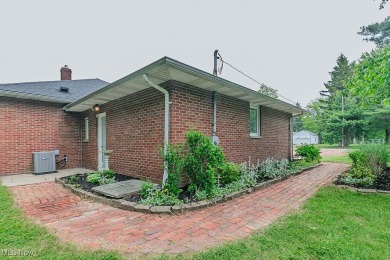 This charming brick ranch offers comfort, privacy, and a unique on Airport Greens Golf Club in Ohio - for sale on GolfHomes.com, golf home, golf lot