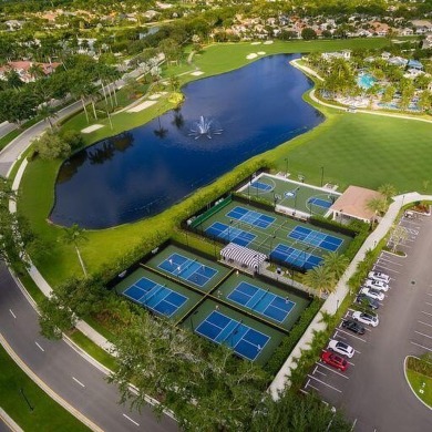 Golf course views fill this charming 2-story home of 4 bedrooms on Woodfield Country Club in Florida - for sale on GolfHomes.com, golf home, golf lot