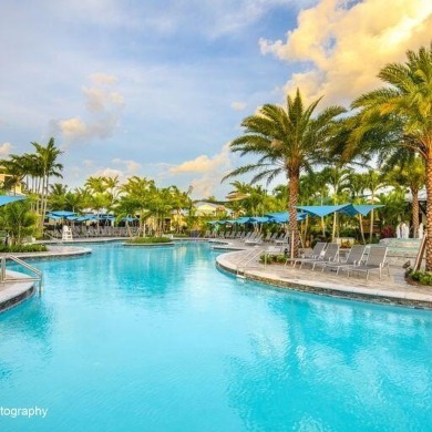 Golf course views fill this charming 2-story home of 4 bedrooms on Woodfield Country Club in Florida - for sale on GolfHomes.com, golf home, golf lot