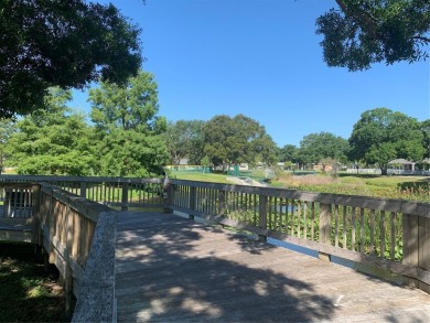 Welcome home to 1714 58th St S in Gulfport, FL.  This amazing on Pasadena Yacht and Country Club in Florida - for sale on GolfHomes.com, golf home, golf lot