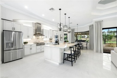 Newly updated! Experience modern elegance in this 3128 sq ft on Shadow Wood Preserve in Florida - for sale on GolfHomes.com, golf home, golf lot