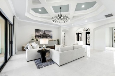 Newly updated! Experience modern elegance in this 3128 sq ft on Shadow Wood Preserve in Florida - for sale on GolfHomes.com, golf home, golf lot