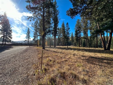 Golfers! This sprawling, level 1 acre building site is located on Double Arrow Lodge in Montana - for sale on GolfHomes.com, golf home, golf lot