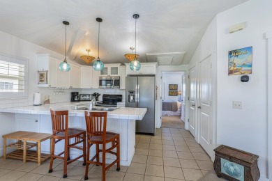 This beautifully decorated 'Hawaiiana-style' 3BR/3BA upstairs on Makai Golf Club At Princeville in Hawaii - for sale on GolfHomes.com, golf home, golf lot