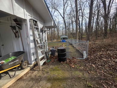 This is a must-see home with 3 bedrooms and 1 and a 1/2 baths on Cherokee Village North Course in Arkansas - for sale on GolfHomes.com, golf home, golf lot