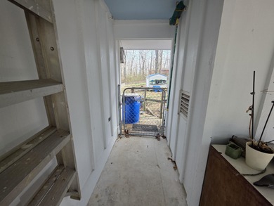 This is a must-see home with 3 bedrooms and 1 and a 1/2 baths on Cherokee Village North Course in Arkansas - for sale on GolfHomes.com, golf home, golf lot