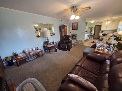 This is a must-see home with 3 bedrooms and 1 and a 1/2 baths on Cherokee Village North Course in Arkansas - for sale on GolfHomes.com, golf home, golf lot