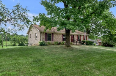 Welcome to this stunning brick ranch perfectly positioned on on Tates Creek Golf Course in Kentucky - for sale on GolfHomes.com, golf home, golf lot