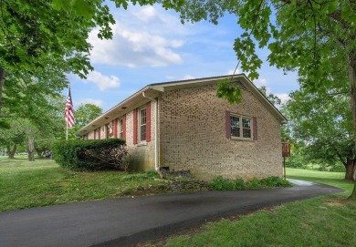Welcome to this stunning brick ranch perfectly positioned on on Tates Creek Golf Course in Kentucky - for sale on GolfHomes.com, golf home, golf lot