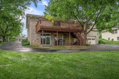 Welcome to this stunning brick ranch perfectly positioned on on Tates Creek Golf Course in Kentucky - for sale on GolfHomes.com, golf home, golf lot