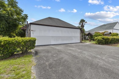 RARE AND DESIRABLE HANGAR HOME OFFERING IN THE EXCLUSIVE SPRUCE on Spruce Creek Golf Club in Florida - for sale on GolfHomes.com, golf home, golf lot