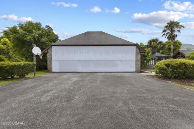 RARE AND DESIRABLE HANGAR HOME OFFERING IN THE EXCLUSIVE SPRUCE on Spruce Creek Golf Club in Florida - for sale on GolfHomes.com, golf home, golf lot