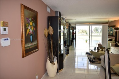 Truly spectacular views are what differentiate this unit from on Sunrise Lakes Phase III in Florida - for sale on GolfHomes.com, golf home, golf lot