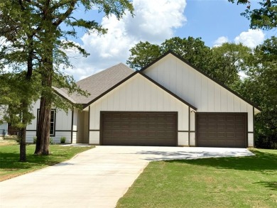 This 4-bedroom, 3-bath home sits on over half an acre on a quiet on Lake Kiowa Golf Course in Texas - for sale on GolfHomes.com, golf home, golf lot