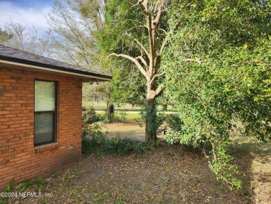 Sturdy brick ranch home with side entry garage.  Located on on Keystone Heights Golf and Country Club in Florida - for sale on GolfHomes.com, golf home, golf lot