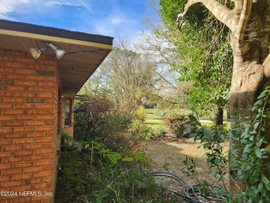 Sturdy brick ranch home with side entry garage.  Located on on Keystone Heights Golf and Country Club in Florida - for sale on GolfHomes.com, golf home, golf lot