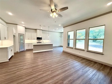 This 4-bedroom, 3-bath home sits on over half an acre on a quiet on Lake Kiowa Golf Course in Texas - for sale on GolfHomes.com, golf home, golf lot