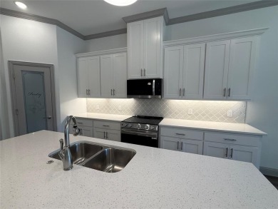 This 4-bedroom, 3-bath home sits on over half an acre on a quiet on Lake Kiowa Golf Course in Texas - for sale on GolfHomes.com, golf home, golf lot