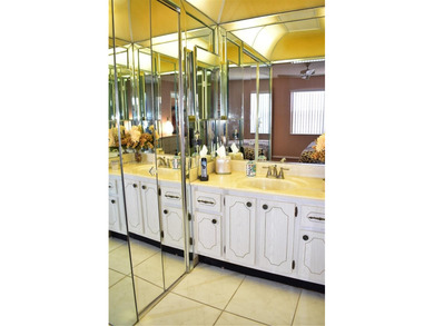 Truly spectacular views are what differentiate this unit from on Sunrise Lakes Phase III in Florida - for sale on GolfHomes.com, golf home, golf lot