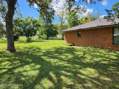 Sturdy brick ranch home with side entry garage.  Located on on Keystone Heights Golf and Country Club in Florida - for sale on GolfHomes.com, golf home, golf lot