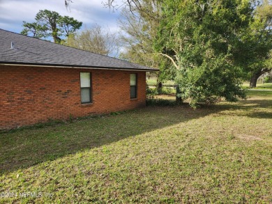 Sturdy brick ranch home with side entry garage.  Located on on Keystone Heights Golf and Country Club in Florida - for sale on GolfHomes.com, golf home, golf lot