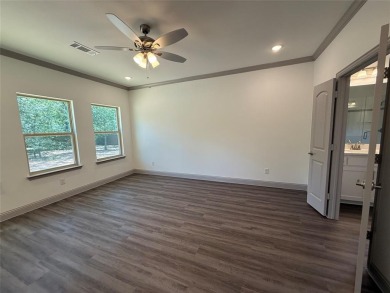 This 4-bedroom, 3-bath home sits on over half an acre on a quiet on Lake Kiowa Golf Course in Texas - for sale on GolfHomes.com, golf home, golf lot