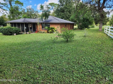 Sturdy brick ranch home with side entry garage.  Located on on Keystone Heights Golf and Country Club in Florida - for sale on GolfHomes.com, golf home, golf lot