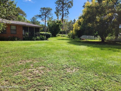 Sturdy brick ranch home with side entry garage.  Located on on Keystone Heights Golf and Country Club in Florida - for sale on GolfHomes.com, golf home, golf lot