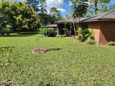 Sturdy brick ranch home with side entry garage.  Located on on Keystone Heights Golf and Country Club in Florida - for sale on GolfHomes.com, golf home, golf lot