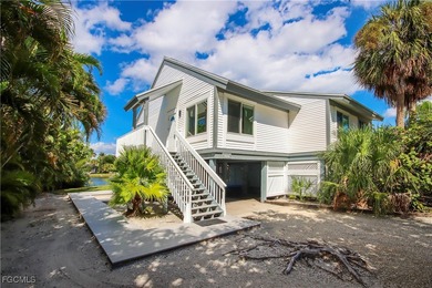 The perfect island retreat! Enjoy beautiful lake views from this on The Dunes Golf and Tennis Club in Florida - for sale on GolfHomes.com, golf home, golf lot