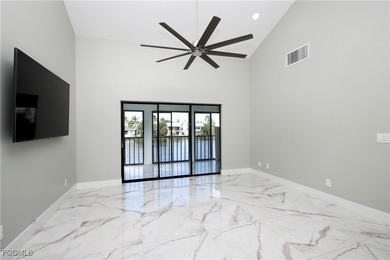 The perfect island retreat! Enjoy beautiful lake views from this on The Dunes Golf and Tennis Club in Florida - for sale on GolfHomes.com, golf home, golf lot