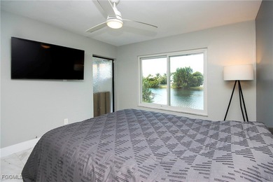The perfect island retreat! Enjoy beautiful lake views from this on The Dunes Golf and Tennis Club in Florida - for sale on GolfHomes.com, golf home, golf lot