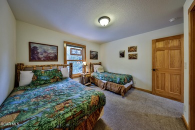 Ideally located just steps from the clubhouse, private lake, and on Grand Lake Golf Course in Colorado - for sale on GolfHomes.com, golf home, golf lot