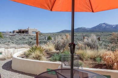 Enjoy indoor and outdoor living spaces as you take in on Taos Country Club in New Mexico - for sale on GolfHomes.com, golf home, golf lot