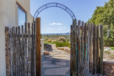 Enjoy indoor and outdoor living spaces as you take in on Taos Country Club in New Mexico - for sale on GolfHomes.com, golf home, golf lot
