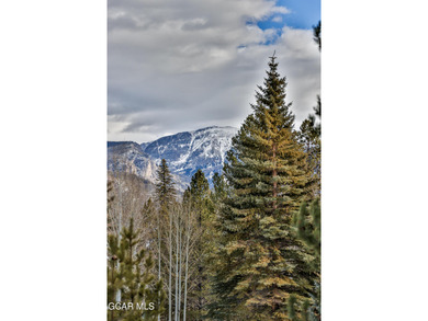 Ideally located just steps from the clubhouse, private lake, and on Grand Lake Golf Course in Colorado - for sale on GolfHomes.com, golf home, golf lot