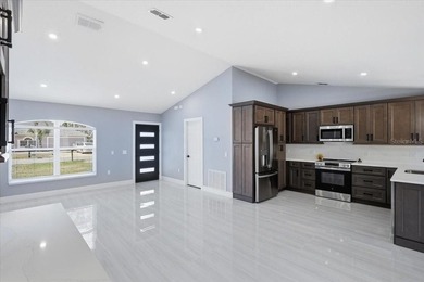 Better Than New and exceptionally upgraded, this stunning home on The Grand Club Cypress Course in Florida - for sale on GolfHomes.com, golf home, golf lot