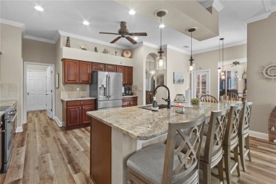 Step into timeless Florida living in this spacious and move in on Heritage Isles Golf and Country Club in Florida - for sale on GolfHomes.com, golf home, golf lot
