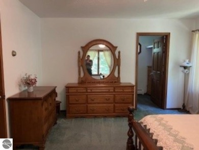 This home in the attractive Michabou Shores Subdivision is about on Crystal Downs Country Club in Michigan - for sale on GolfHomes.com, golf home, golf lot